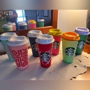 Starbucks collection of 7 cups with lids.